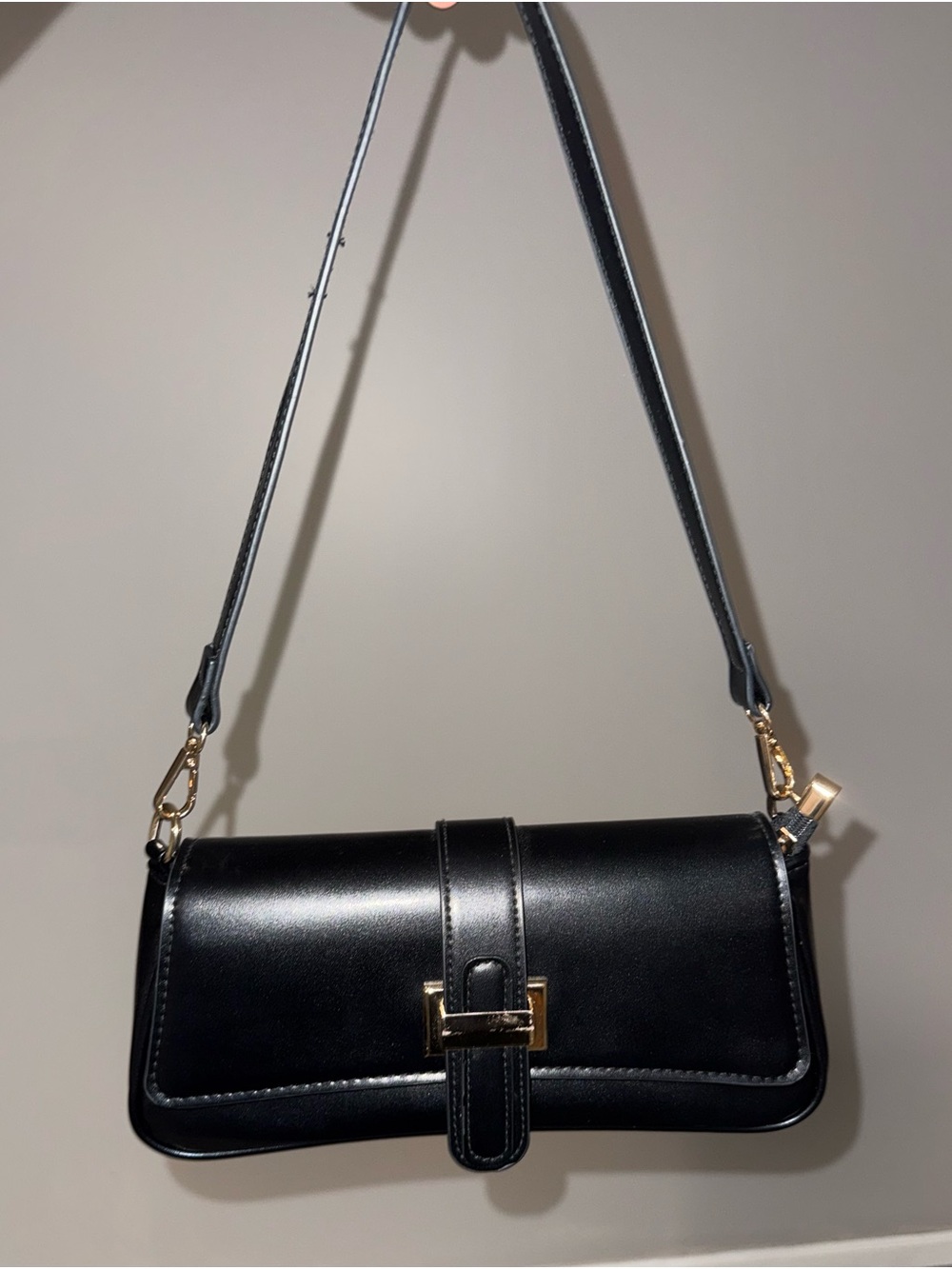 Sleek Black Leather Shoulder Bag with Gold Hardware
